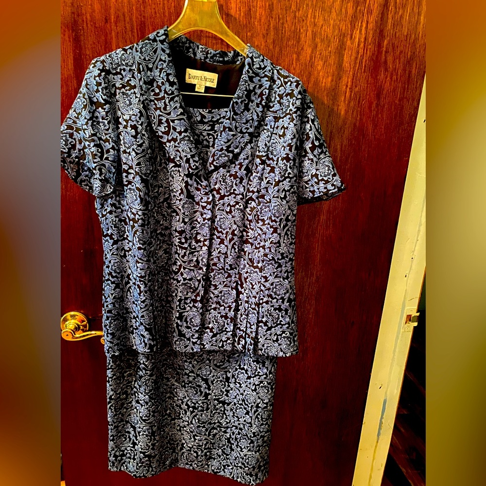 Two piece blue design with black background.  Top and skirt